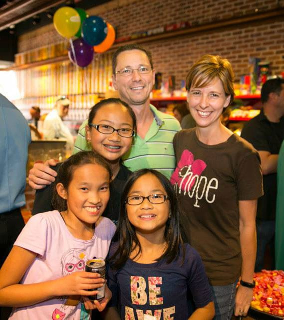 Smiling family in store